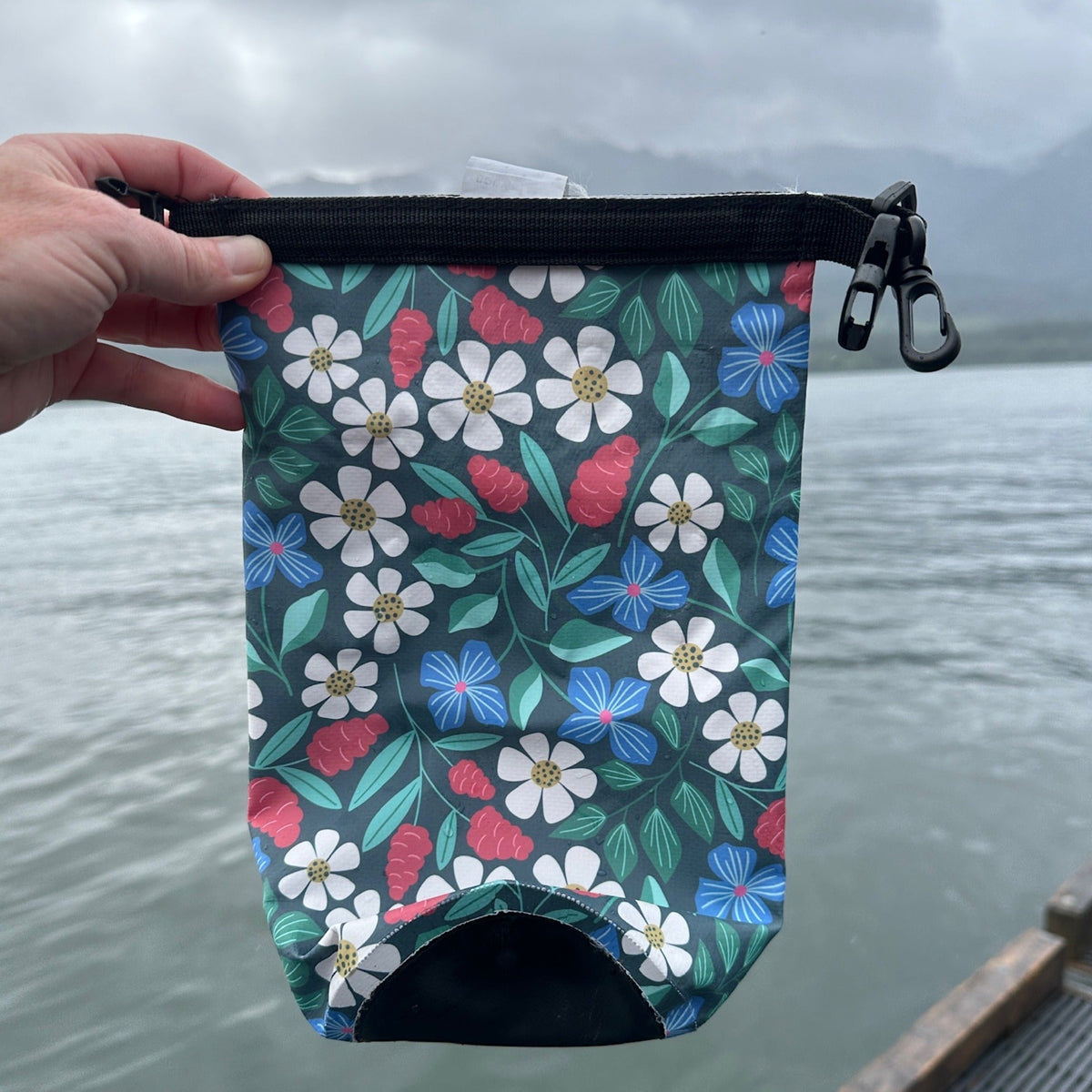 2L colorful, floral dry bag against a cold water backdrop