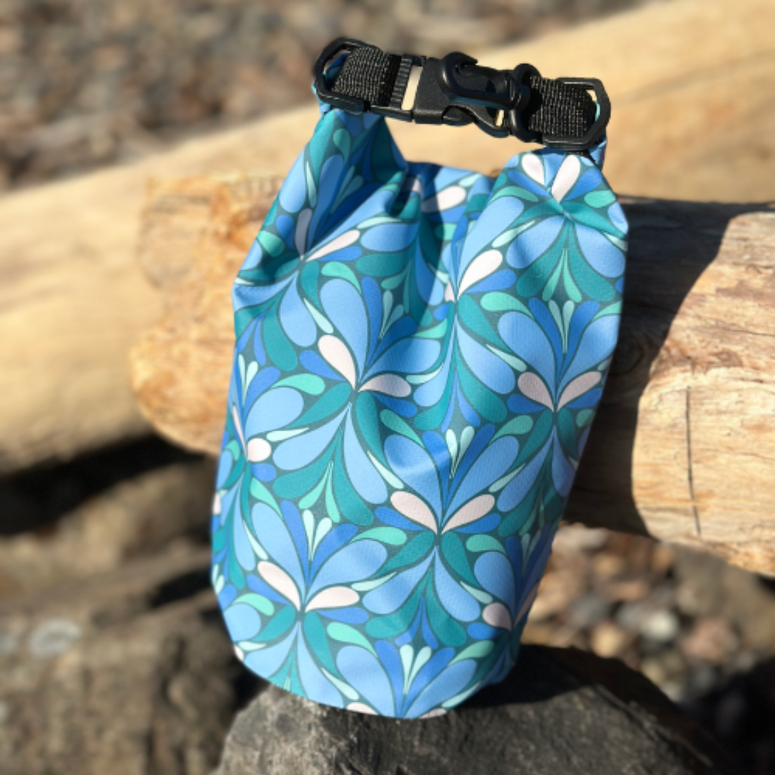 Yuba River Dry Bag sitting on a log