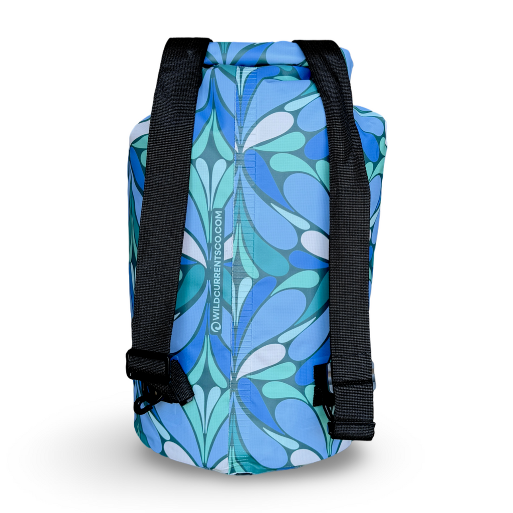 Blue floral-patterned backpack with black straps on a white background