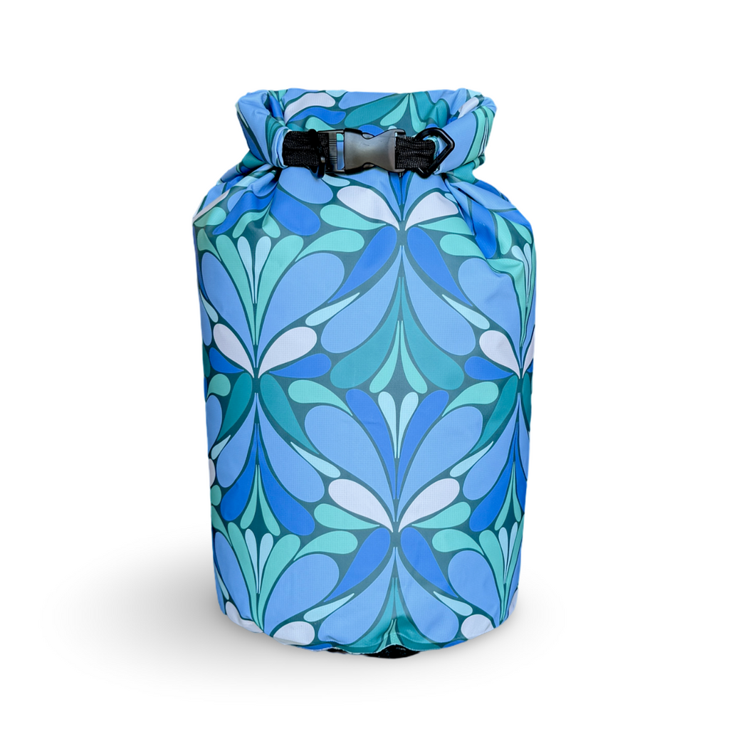 Blue floral-patterned dry bag on a white background