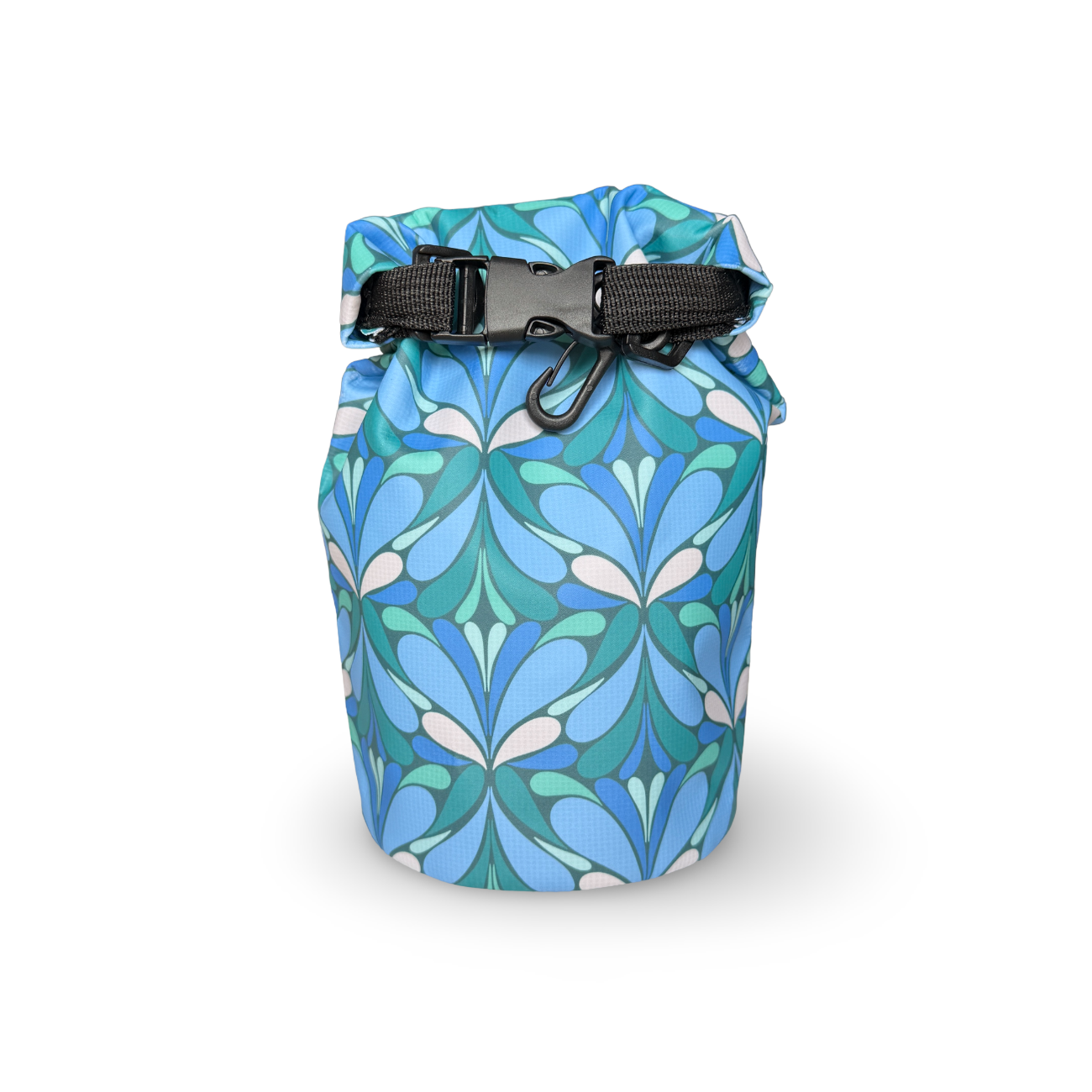 Wild Current dry bag in blue and teal geometric floral pattern waterproof dry bag with black roll-top buckle closure, isolated on a white background