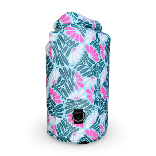 Back view of the tropical floral Napili 10L dry bag on a white background, highlighting the black attachment loop and bottom D-ring for a single removable shoulder strap.