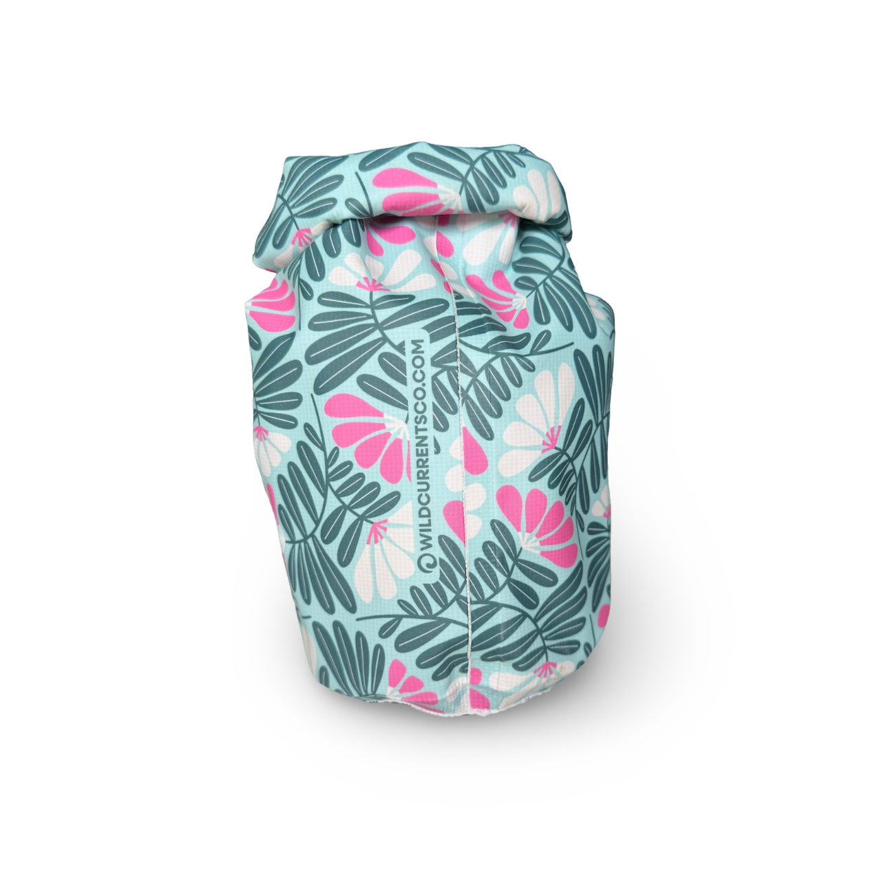 Side angle of a white, green, and pink tropical pattern waterproof dry sack showcasing the roll-top buckle closure.