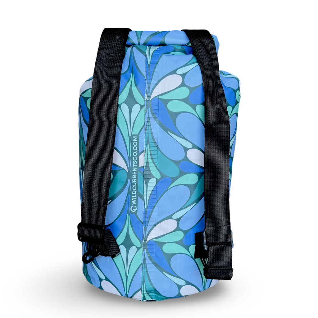 Back view of the patterned Yuba 20L dry bag on a plain white background, highlighting two thick, adjustable black removable backpack straps.